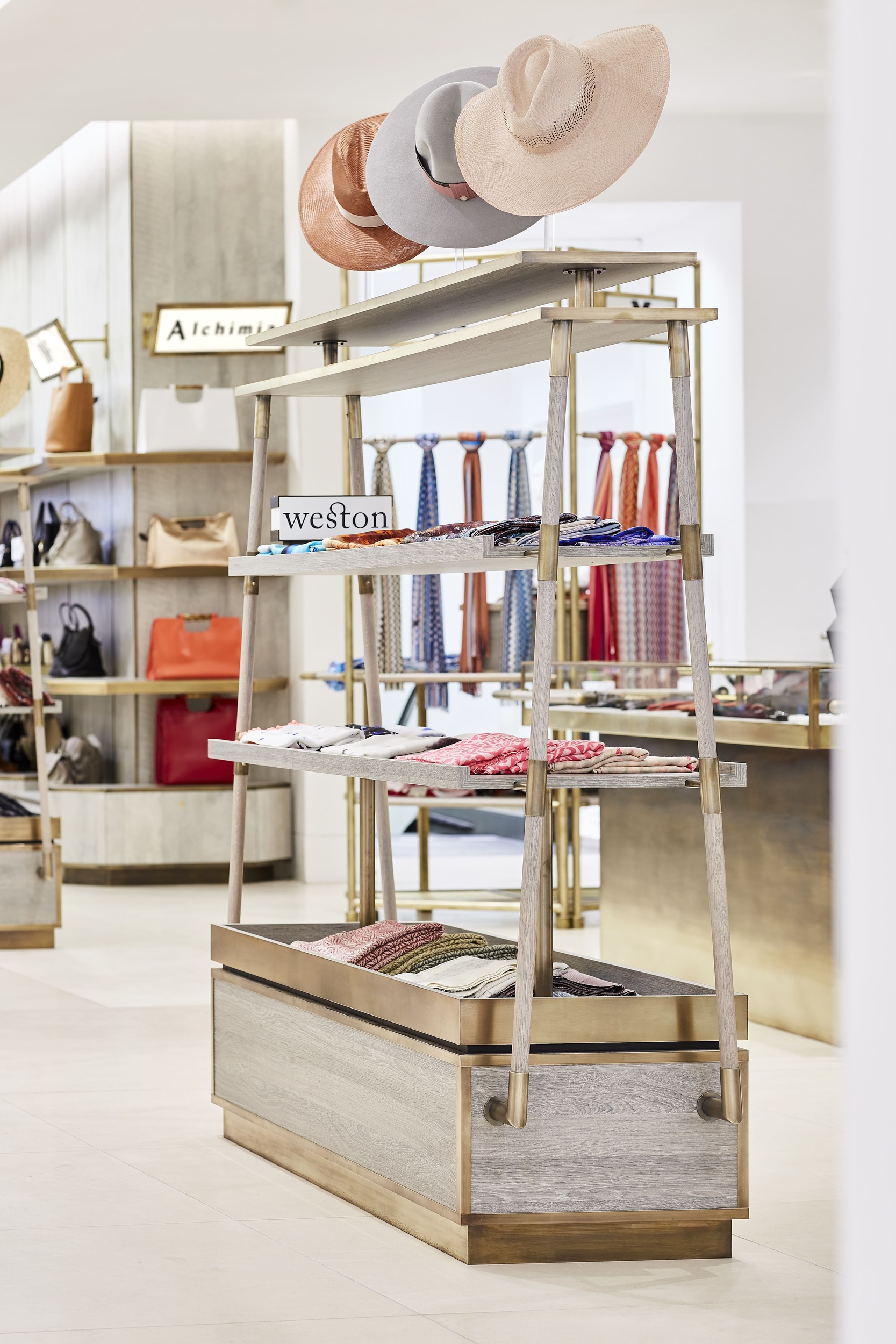 Freestanding shelving display with brass detail