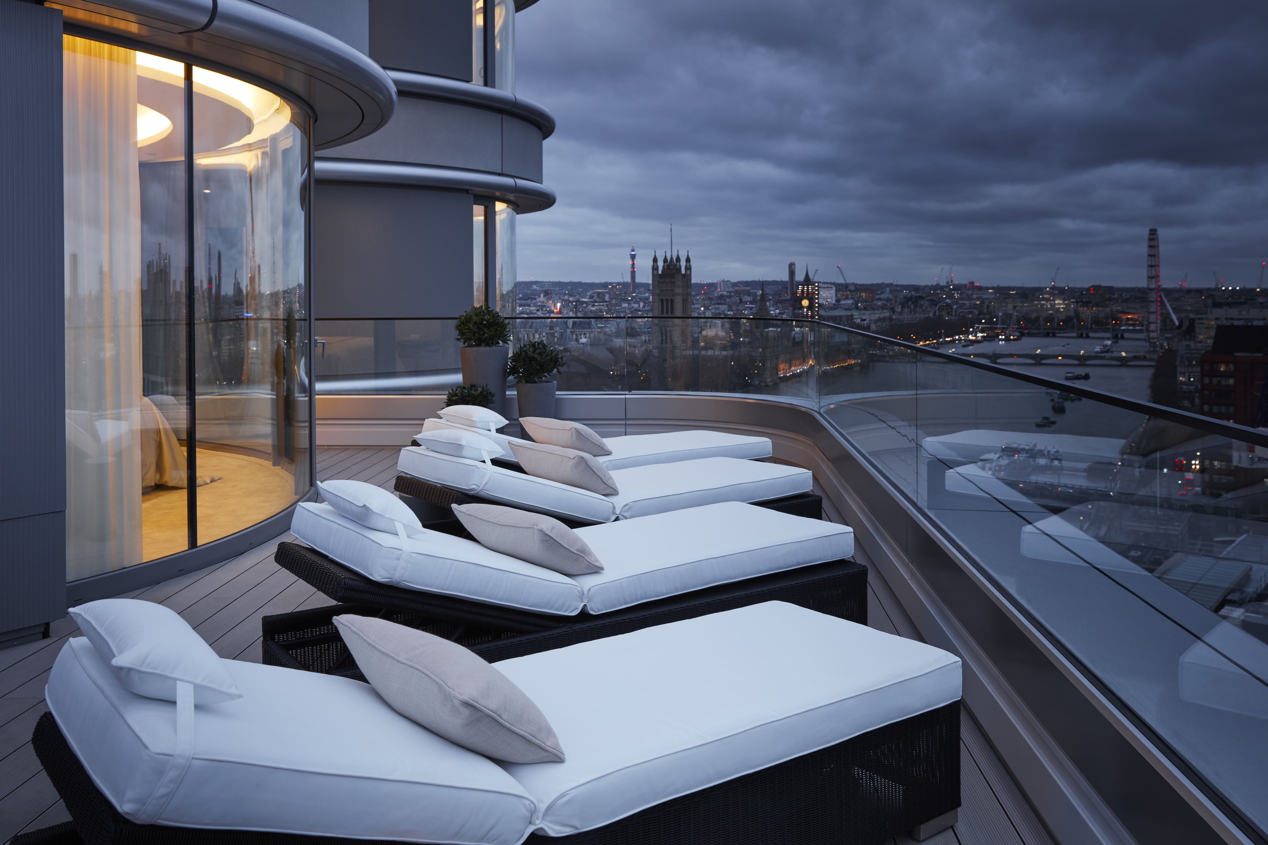 Balcony and loungers overlook London skyline
