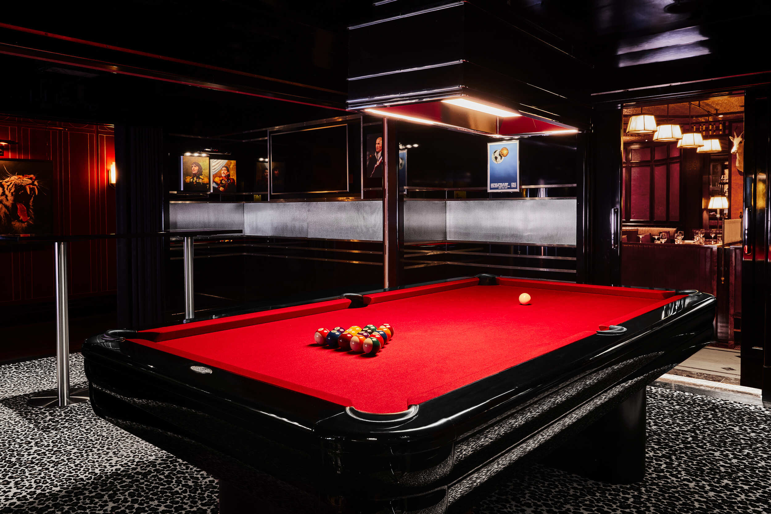Luxurious pool table with ambient lighting, set up for play