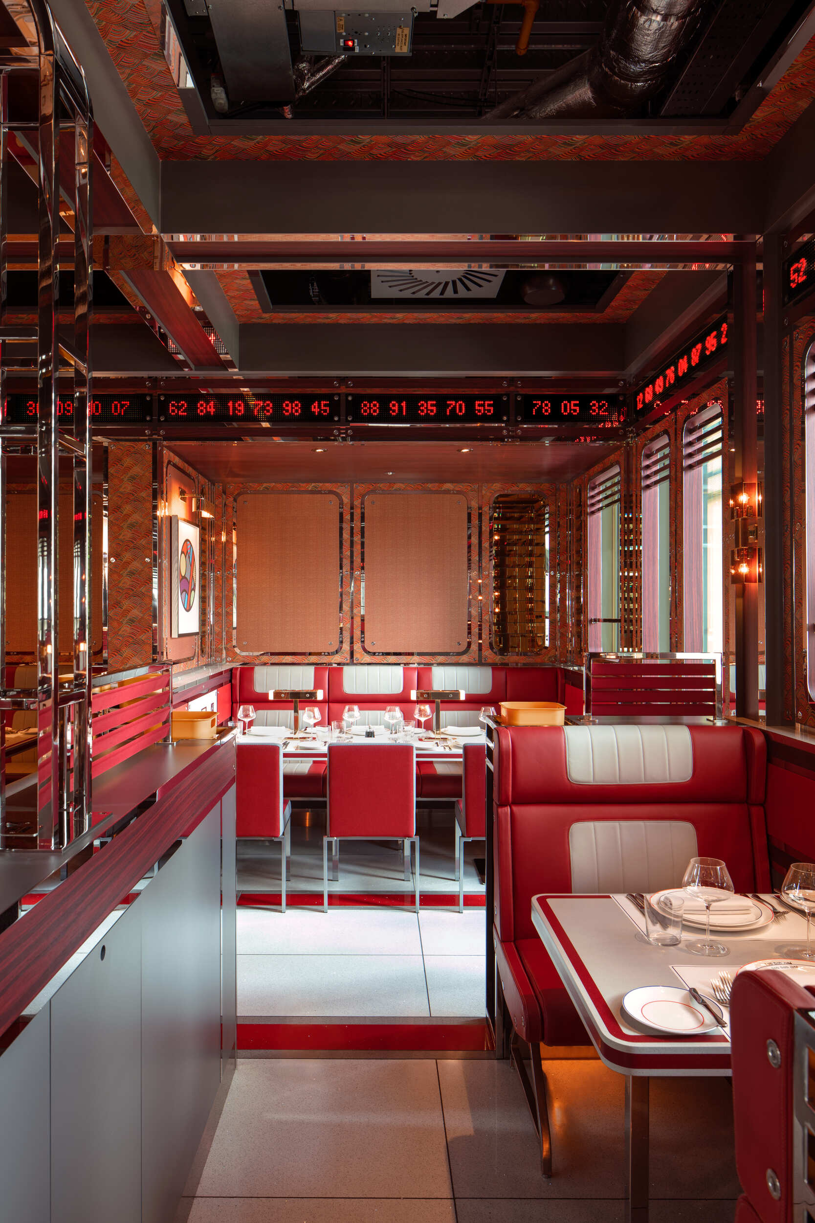 side view of red booth with retro banquette table dining