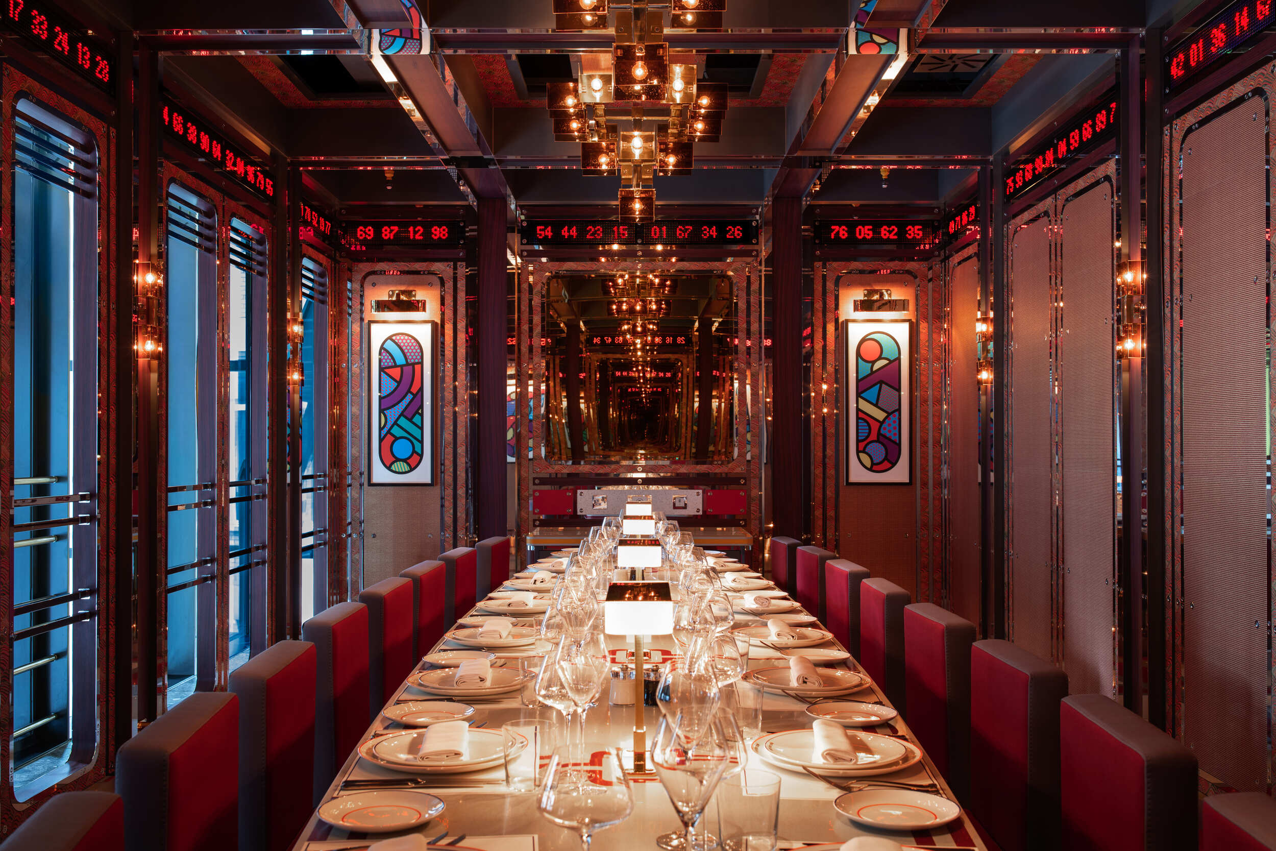 Large opulent private dining area decorated with modern art