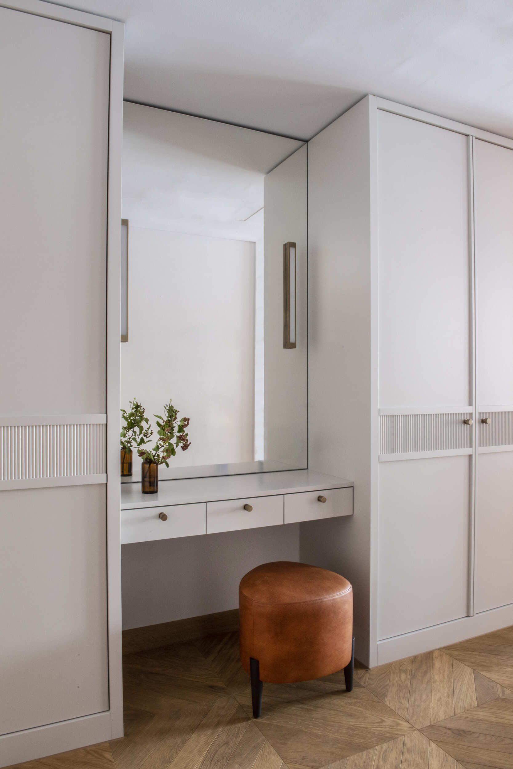 Modern dressing area with leather stool