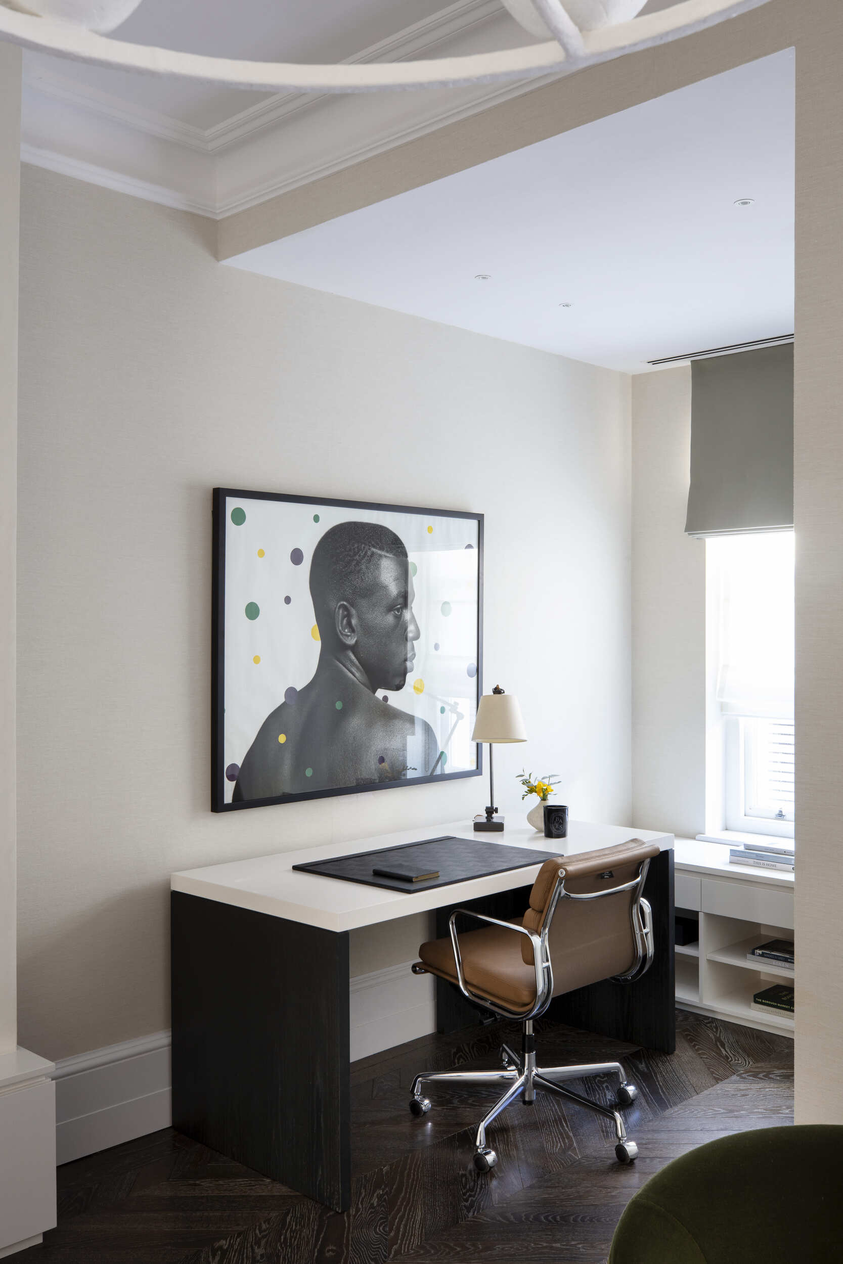 Study in perfection with wall mounted artwork