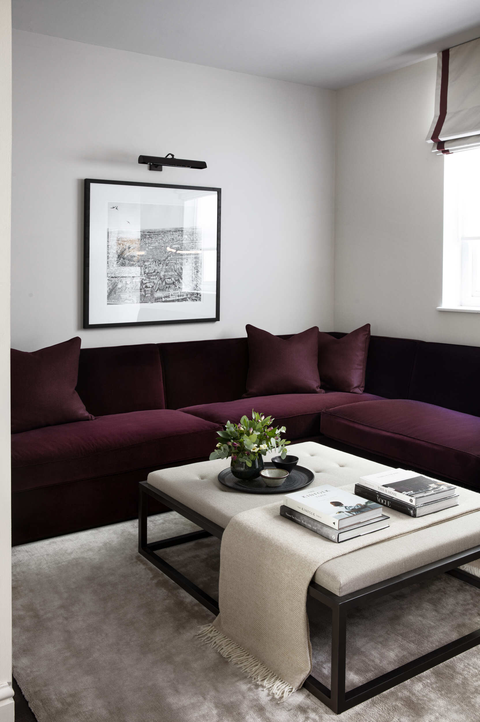 Comfortable room with wall sofa and coffee table