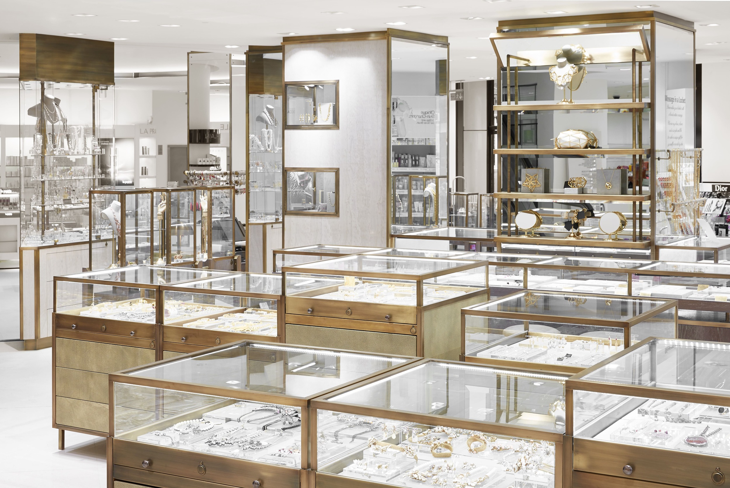 Contemporary jewellery display cases with aged brass framing
