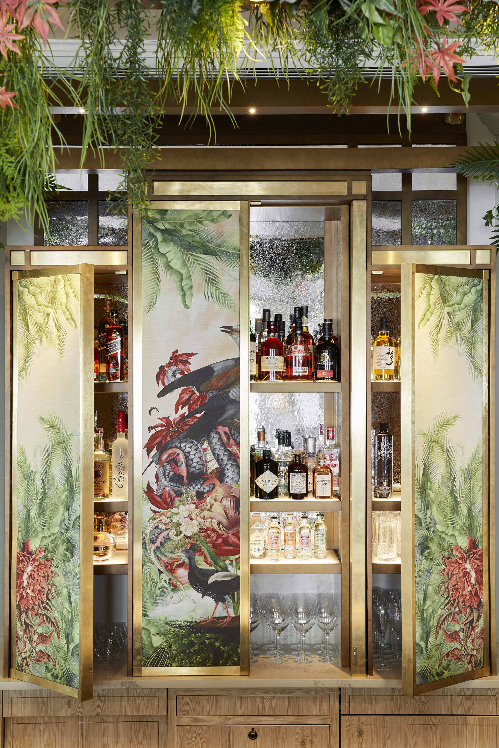 Oriental inspired bar cabinet with hanging flora