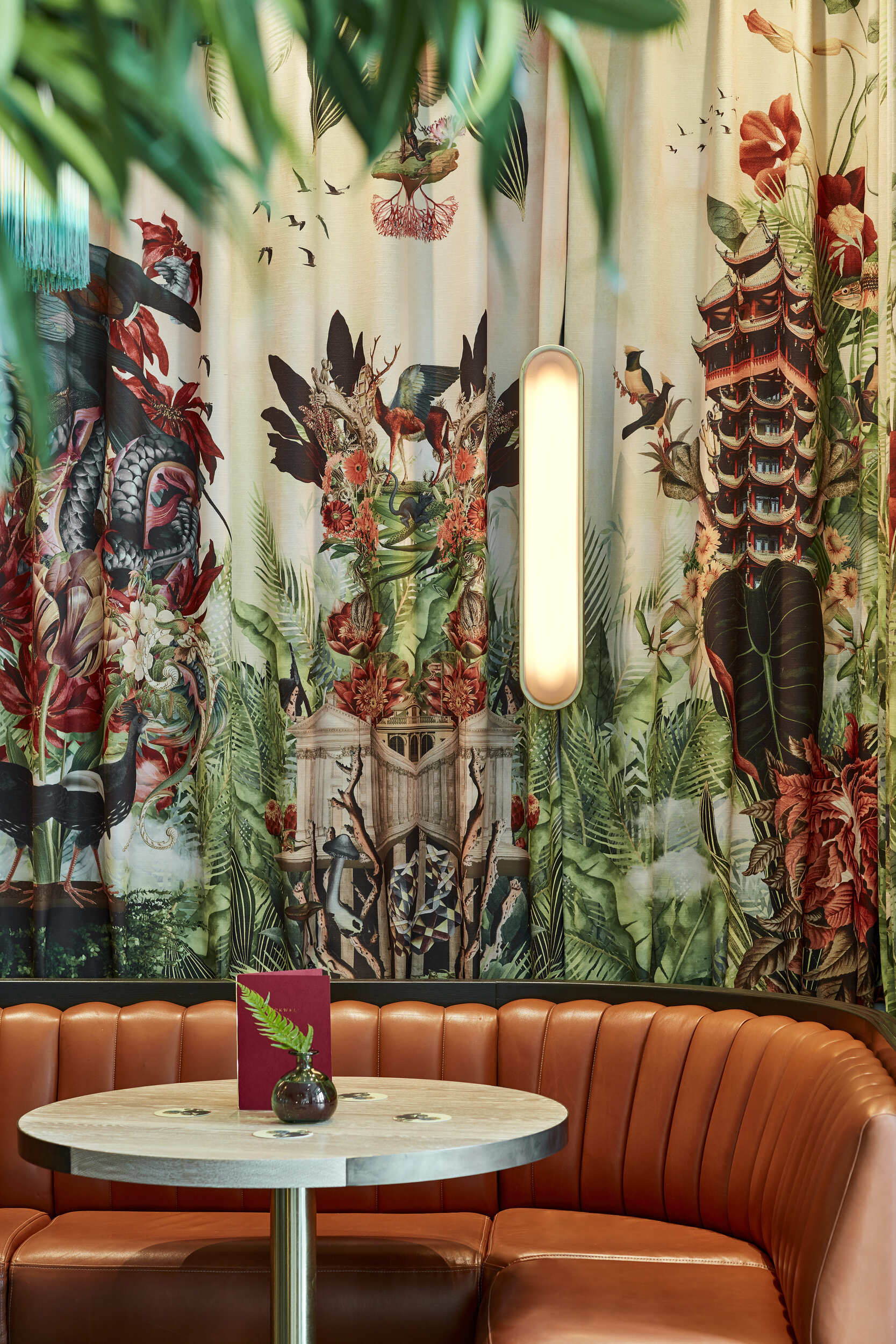 Bespoke fabric walls in cocktail bar with leather seating