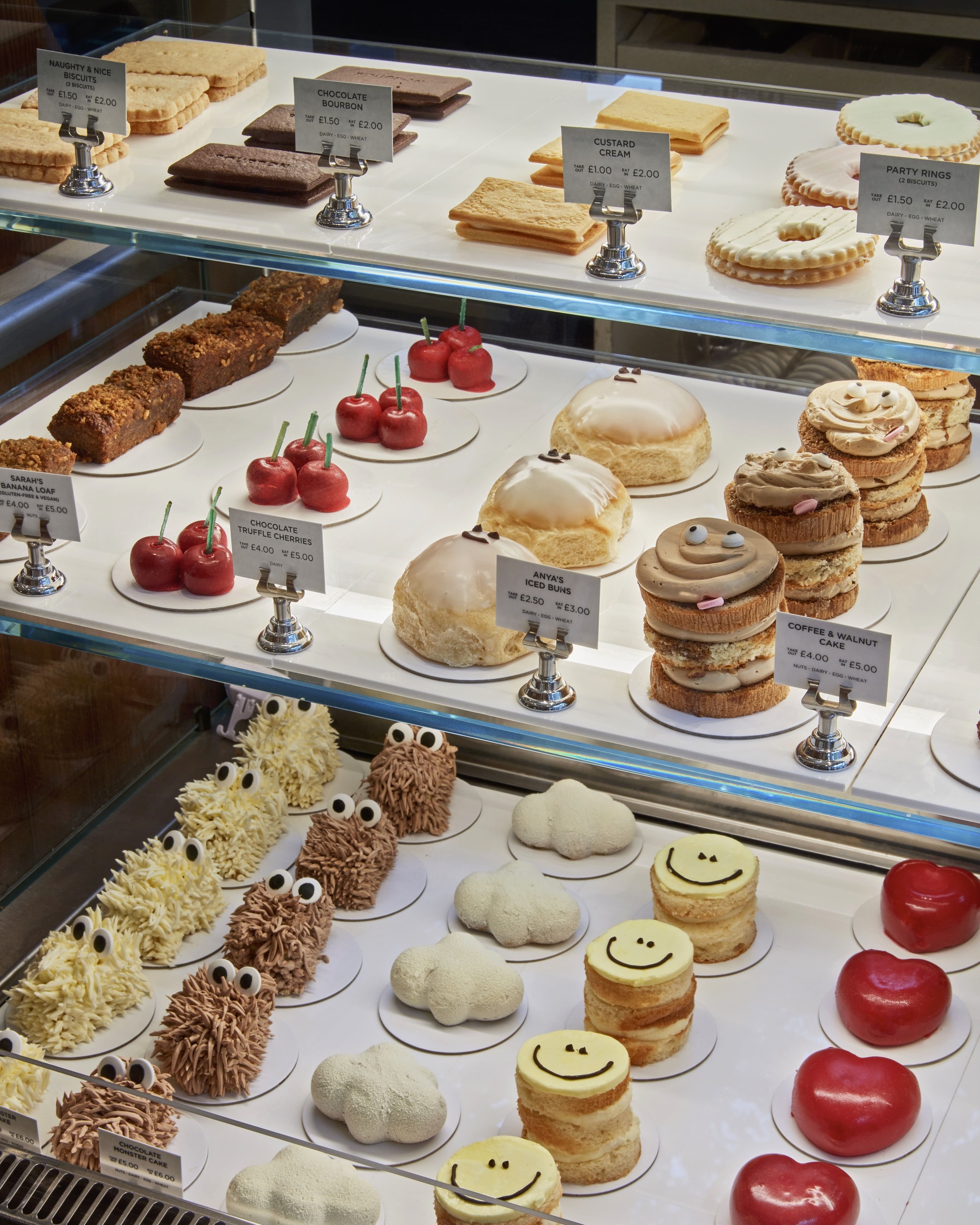 Delicate pastries displayed behind glass