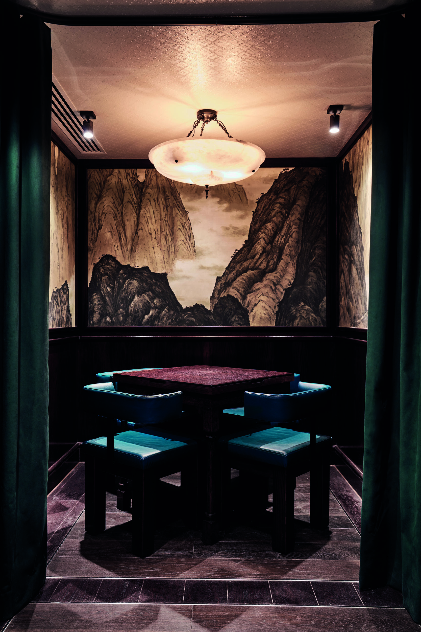 Ambient private dining area with decorative wall mural