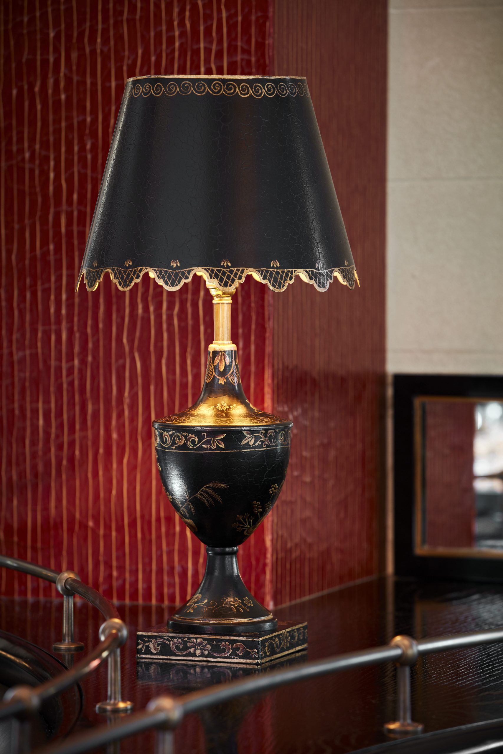 Classic table lamp on red cracked gesso background