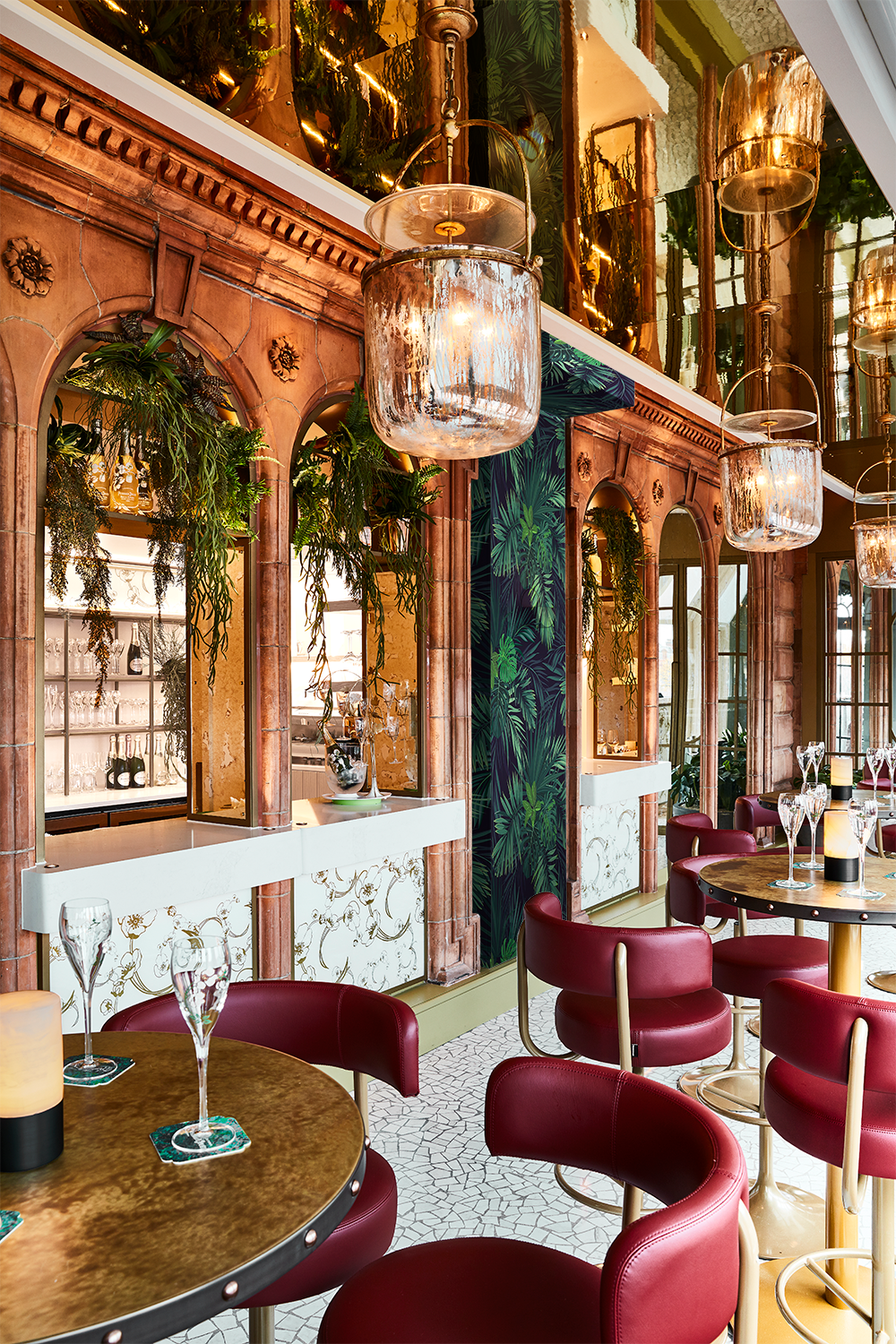 Harrods Perrier-Jouet Bar with red seats and background foliage