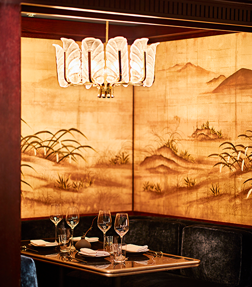 Oriental dining alcove with ambient lighting & exquisite tableware