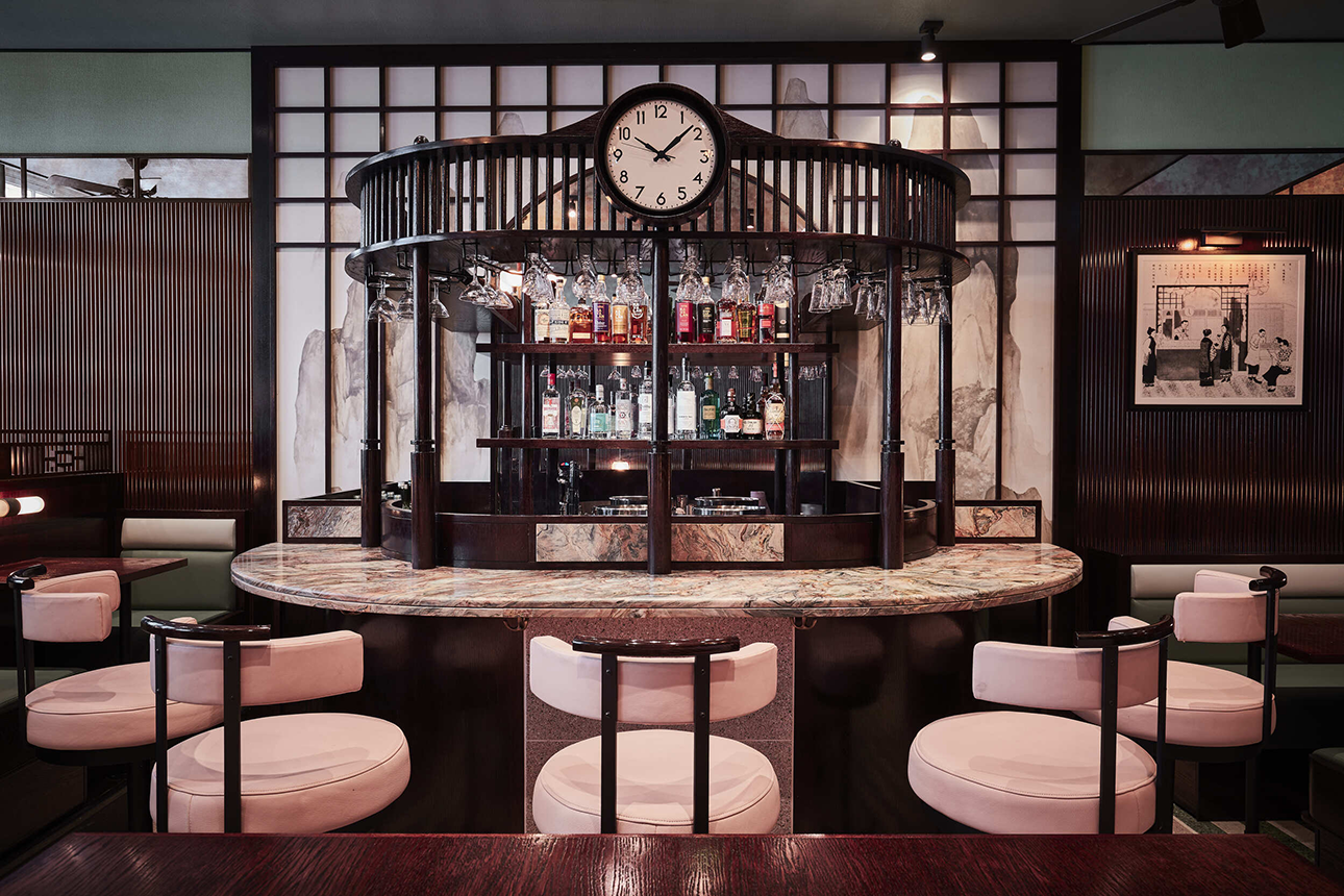 cafe xu curved bar with white stools