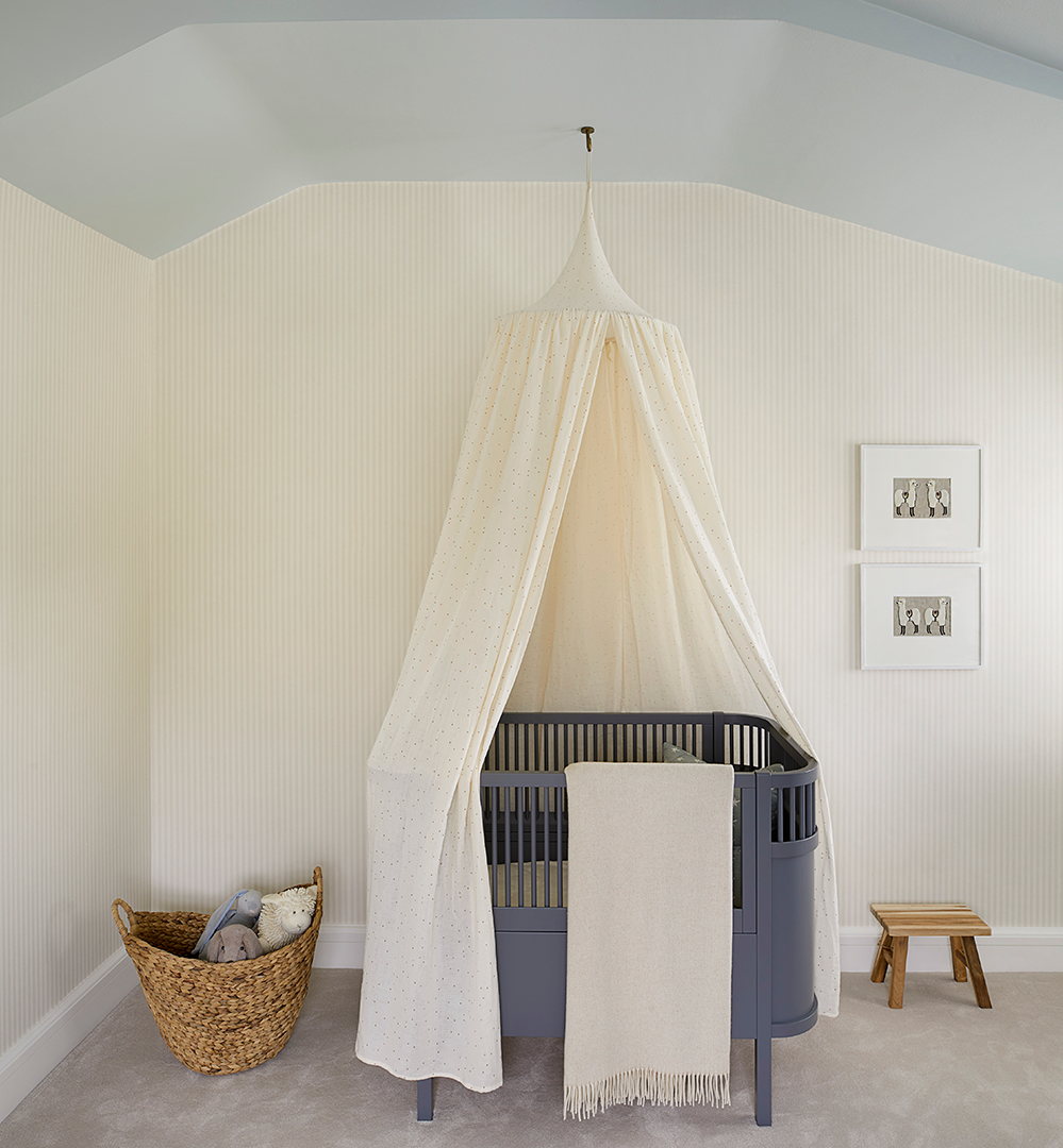 Draped baby cot in nursery