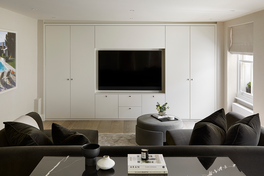 Relaxed family media room with bespoke storage and u-shaped sofa