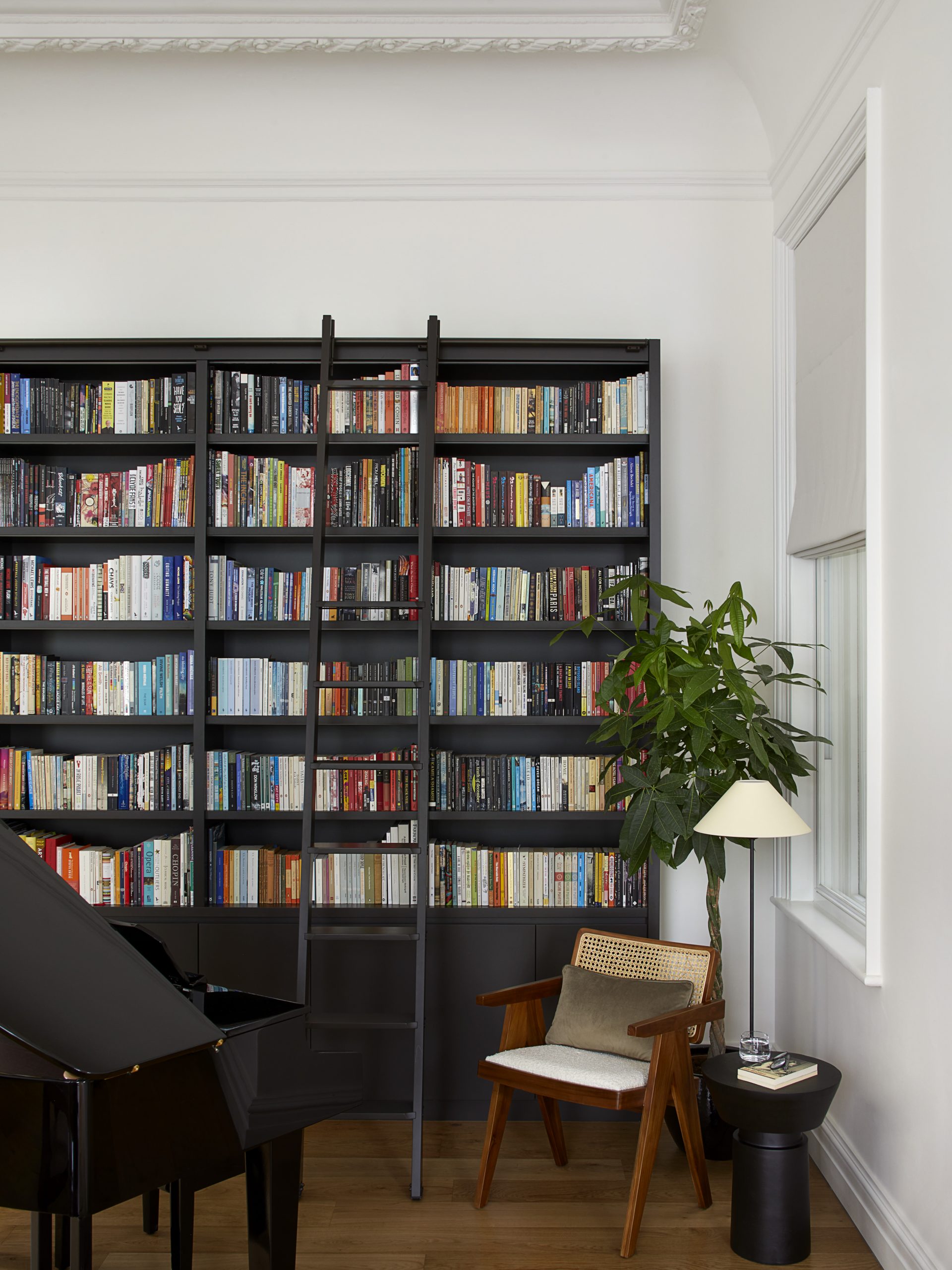 Library wall with baby grand piano